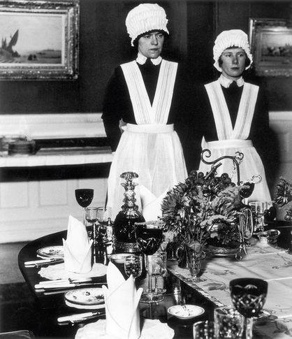 Parlourmaid and Under-parlourmaid ready to serve dinner, 1936 © Bill Brandt / Bill Brandt Archive Ltd.
